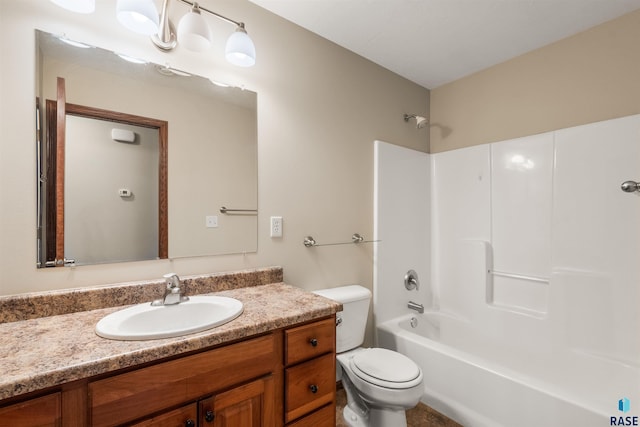 full bath with toilet, vanity, and bathing tub / shower combination
