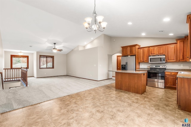 kitchen featuring light carpet, recessed lighting, a center island, brown cabinets, and appliances with stainless steel finishes