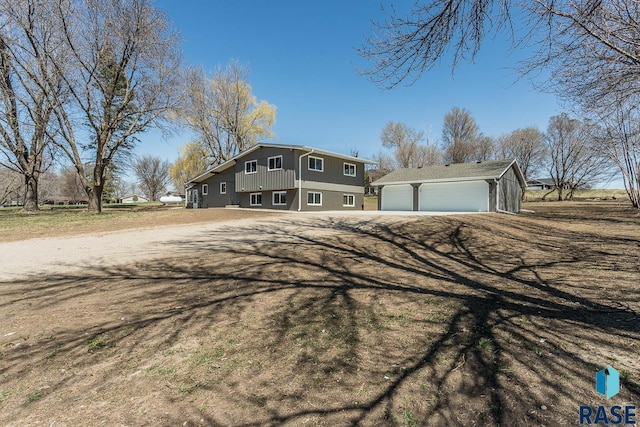1000 N Six Mile Rd, Sioux Falls, SD 57110 - view of front of home featuring a detached garage and an outdoor structure