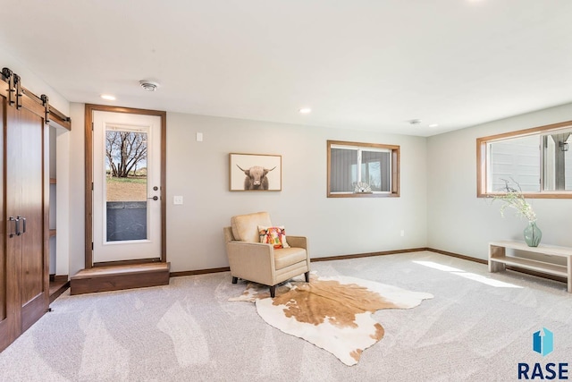 1000 N Six Mile Rd, Sioux Falls, SD 57110 - sitting room with recessed lighting, a barn door, baseboards, and carpet