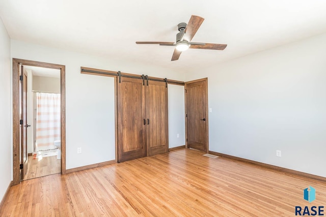 1000 N Six Mile Rd, Sioux Falls, SD 57110 - unfurnished bedroom with light wood-style floors, baseboards, and visible vents