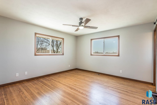 1000 N Six Mile Rd, Sioux Falls, SD 57110 - spare room with light wood-type flooring, ceiling fan, baseboards, and visible vents