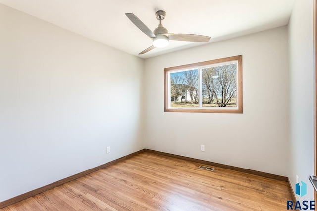 1000 N Six Mile Rd, Sioux Falls, SD 57110 - spare room with baseboards, visible vents, light wood-type flooring, and a ceiling fan