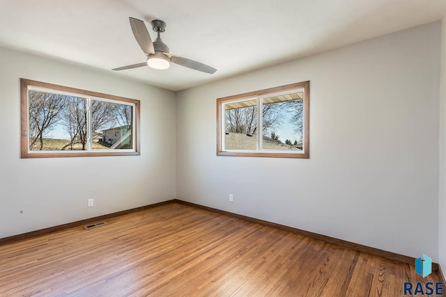 1000 N Six Mile Rd, Sioux Falls, SD 57110 - spare room featuring light wood finished floors, visible vents, and baseboards