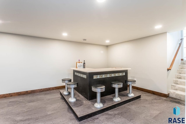 1000 N Six Mile Rd, Sioux Falls, SD 57110 - bar with a bar, recessed lighting, baseboards, and stairway