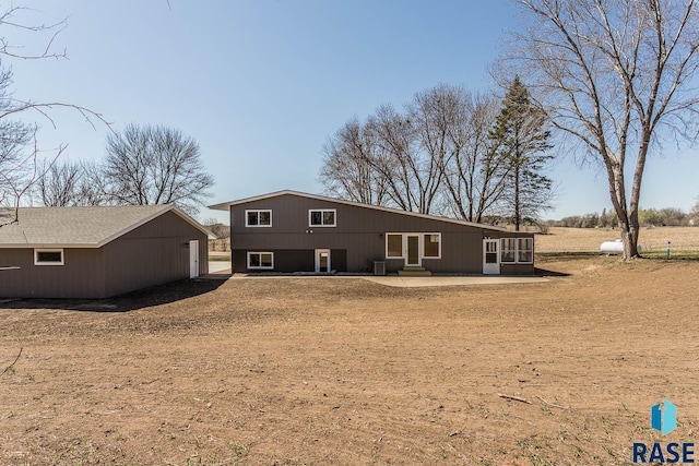 1000 N Six Mile Rd, Sioux Falls, SD 57110 - back of house featuring a sunroom