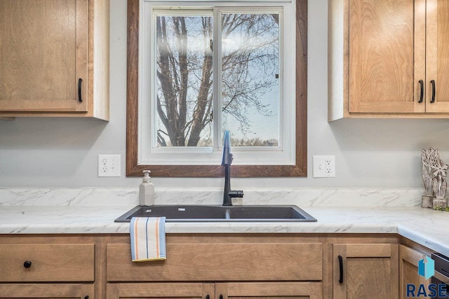 1000 N Six Mile Rd, Sioux Falls, SD 57110 - kitchen with light stone countertops and a sink