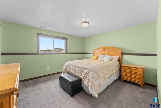 5320 S Solono Ave, Sioux Falls, SD 57108 - bedroom with visible vents, baseboards, carpet flooring, and a textured ceiling