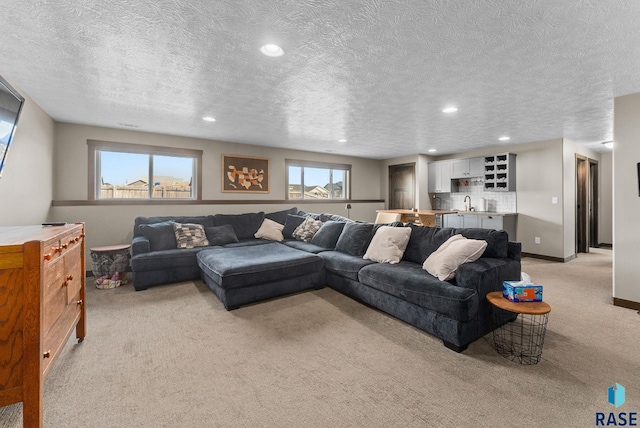 5320 S Solono Ave, Sioux Falls, SD 57108 - living area featuring a textured ceiling, light colored carpet, baseboards, and recessed lighting