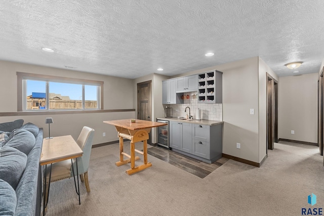5320 S Solono Ave, Sioux Falls, SD 57108 - kitchen with tasteful backsplash, baseboards, open shelves, wine cooler, and carpet flooring