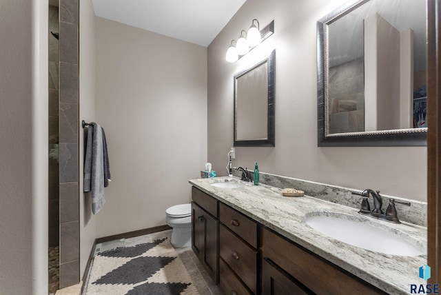 5320 S Solono Ave, Sioux Falls, SD 57108 - bathroom featuring a sink, toilet, and tiled shower