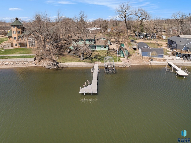 birds eye view of property with a water view and a residential view