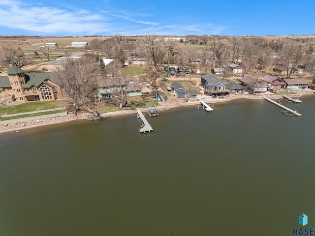 drone / aerial view with a water view and a residential view