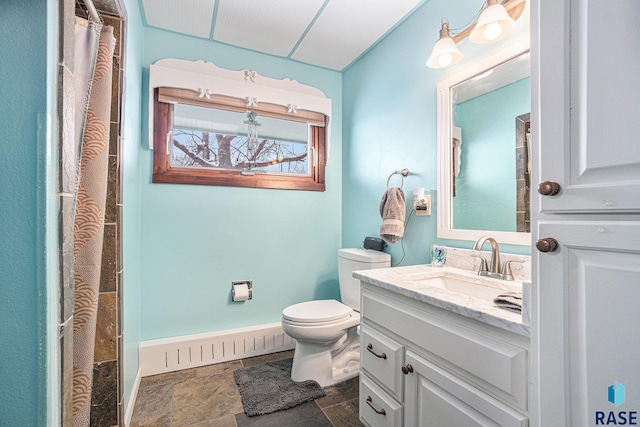 bathroom featuring vanity, a baseboard heating unit, curtained shower, toilet, and stone finish flooring