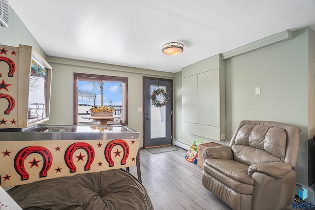 interior space featuring an AC wall unit and wood finished floors