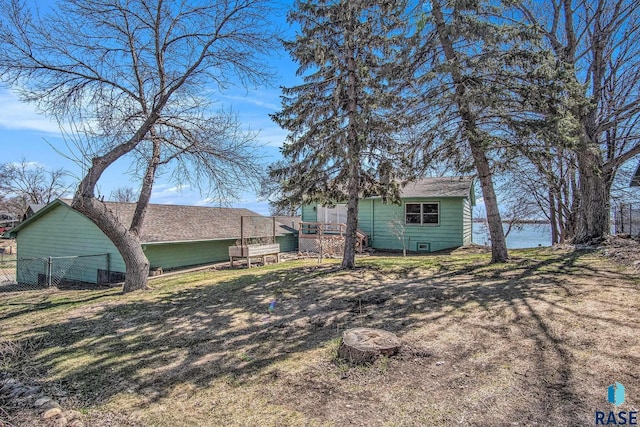 view of yard with a wooden deck and fence