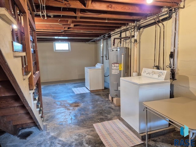 basement featuring independent washer and dryer and water heater