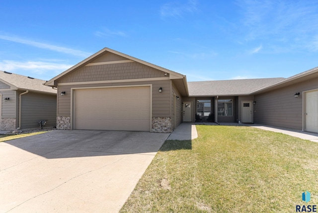 ranch-style home featuring an attached garage, stone siding, a front yard, and concrete driveway