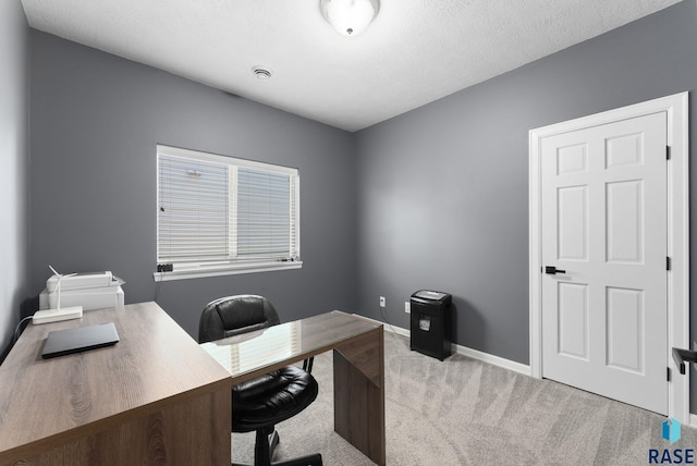 carpeted office with baseboards