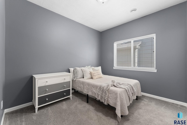bedroom with baseboards and carpet flooring
