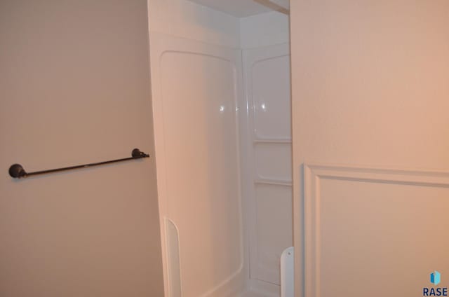 full bathroom featuring walk in shower