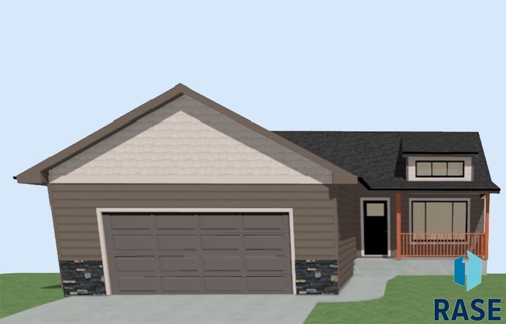 804 N Main St, Lennox, SD 57039 - view of front of house featuring an attached garage and concrete driveway
