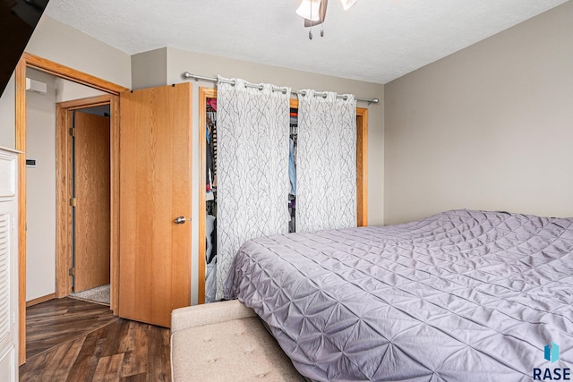 bedroom featuring a ceiling fan and wood finished floors