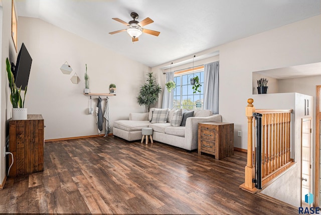 living room with ceiling fan, lofted ceiling, wood finished floors, and baseboards