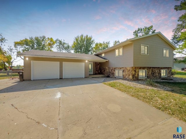 47205 94th St, Sioux Falls, SD 57108 - tri-level home with stone siding and concrete driveway