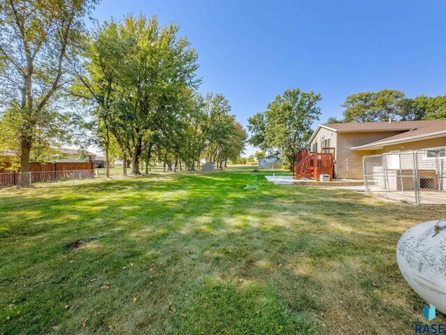47205 94th St, Sioux Falls, SD 57108 - view of yard with fence and a deck