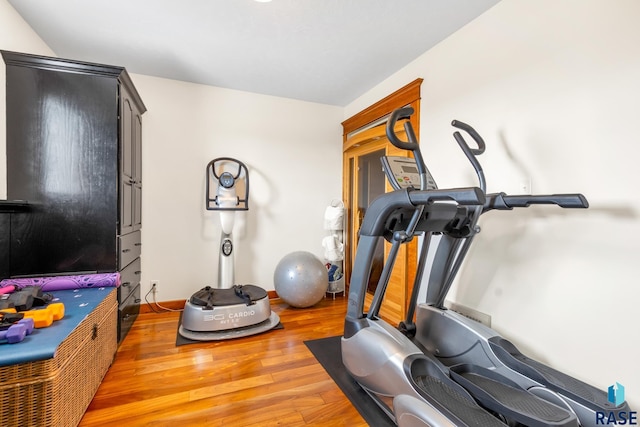 workout area with wood finished floors