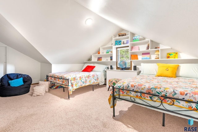 carpeted bedroom featuring lofted ceiling
