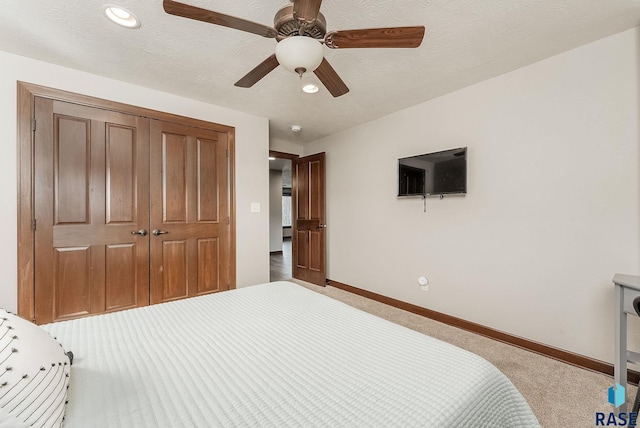 carpeted bedroom featuring a closet, baseboards, a ceiling fan, and recessed lighting