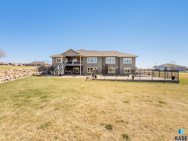 back of house with a yard, a patio, stairway, and fence