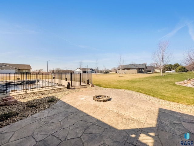 view of patio featuring a fire pit and fence