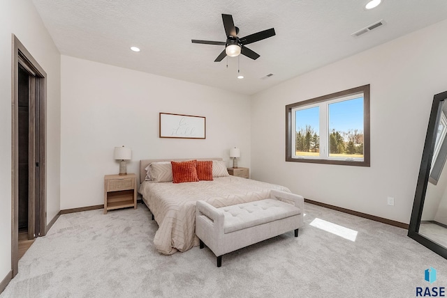 bedroom featuring recessed lighting, visible vents, baseboards, and light carpet