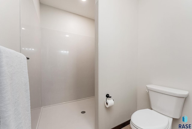 bathroom with toilet and walk in shower