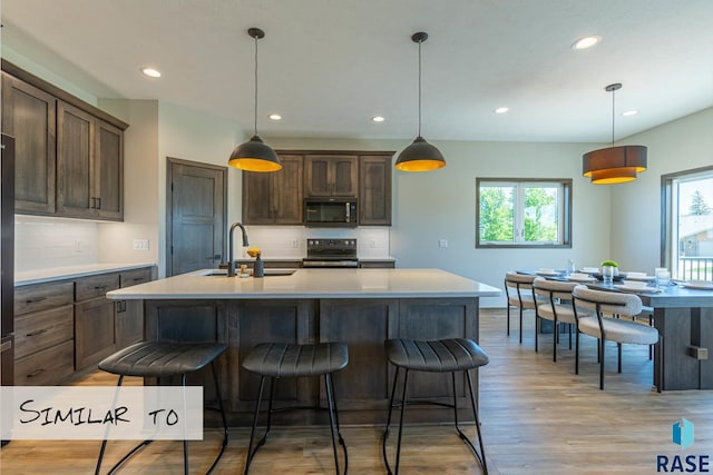 kitchen featuring recessed lighting, plenty of natural light, appliances with stainless steel finishes, and a sink