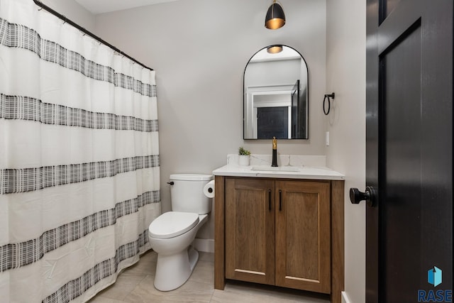 bathroom with tile patterned flooring, vanity, curtained shower, and toilet