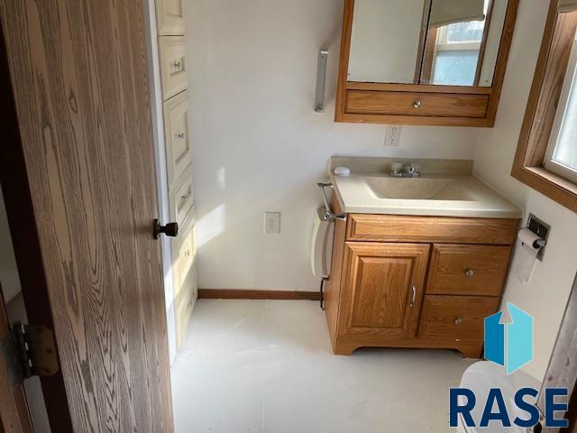 1131 Williams St, Larchwood, IA 51241 - bathroom with a healthy amount of sunlight and vanity