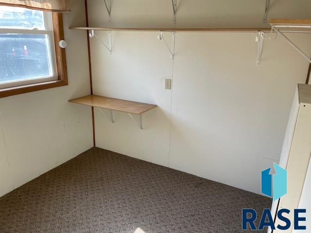 1131 Williams St, Larchwood, IA 51241 - interior space featuring carpet flooring