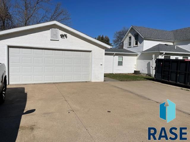 1131 Williams St, Larchwood, IA 51241 - exterior space featuring an outdoor structure and central AC unit