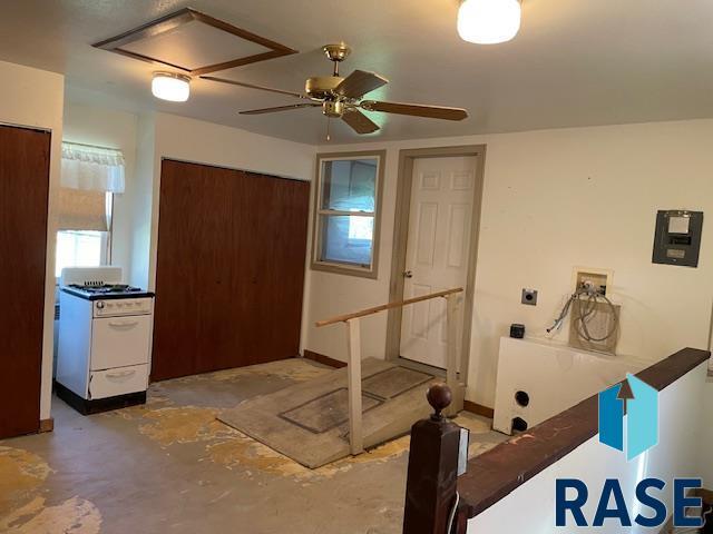 1131 Williams St, Larchwood, IA 51241 - workout area featuring attic access and a ceiling fan