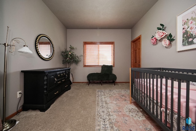 7304 W Lobelia St, Sioux Falls, SD 57106 - bedroom with baseboards, carpet flooring, and a crib