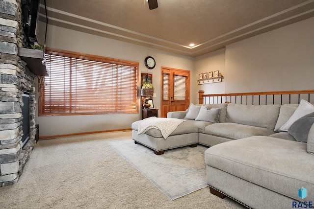 7304 W Lobelia St, Sioux Falls, SD 57106 - living room featuring carpet floors, a ceiling fan, baseboards, and a fireplace
