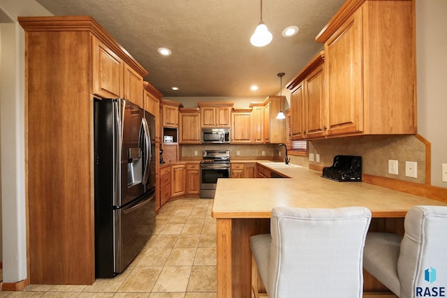 7304 W Lobelia St, Sioux Falls, SD 57106 - kitchen with light countertops, recessed lighting, stainless steel appliances, and a peninsula