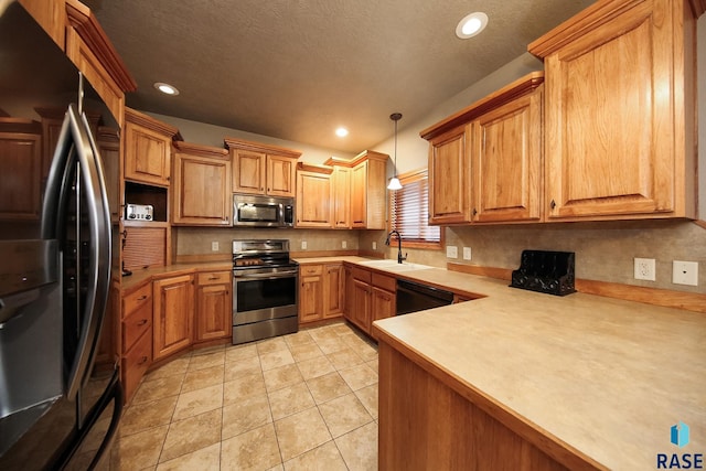 7304 W Lobelia St, Sioux Falls, SD 57106 - kitchen featuring a sink, light countertops, recessed lighting, backsplash, and black appliances
