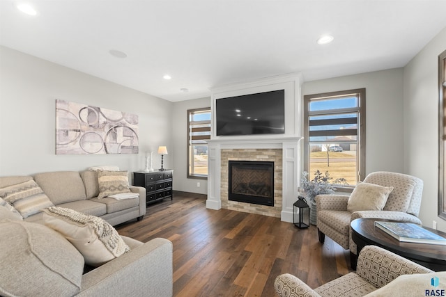 912 Torrey Pine Ln, Sioux Falls, SD 57110 - living area with a fireplace, a healthy amount of sunlight, recessed lighting, and dark wood finished floors