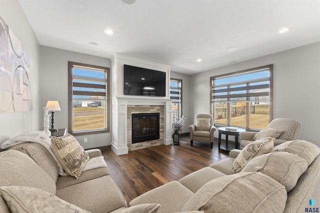 912 Torrey Pine Ln, Sioux Falls, SD 57110 - living area with a glass covered fireplace, hardwood / wood-style floors, and recessed lighting