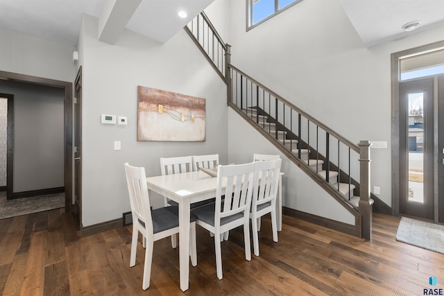 912 Torrey Pine Ln, Sioux Falls, SD 57110 - dining room with baseboards, wood finished floors, a healthy amount of sunlight, and stairs